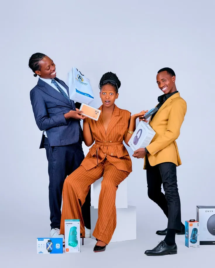 Three shoppers excited about new gadgets
