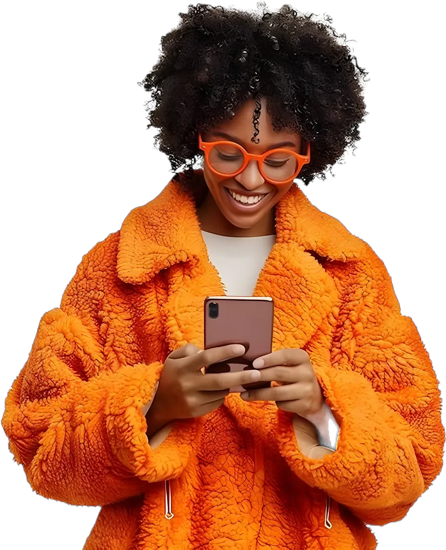 Smiling woman in an orange coat using her phone